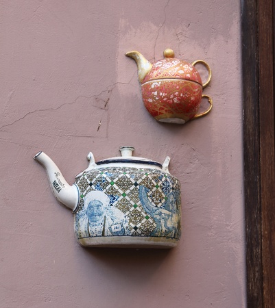 Teapots embedded in facade of old building in Vilnius, Lithuania.の写真素材