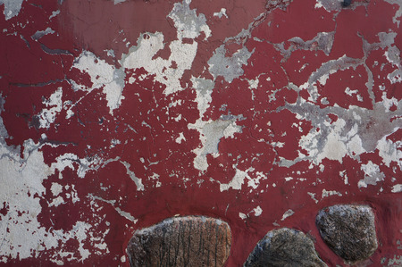Ancient weathered damaged red wall texture. の写真素材