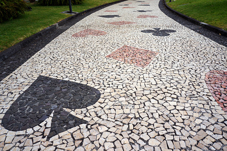 Mosaic paving tile pattern of footpath in Funchal, Madeira, Portugal.の写真素材