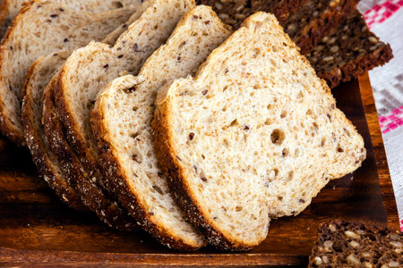 Slices of wheat bread baked with seeds.