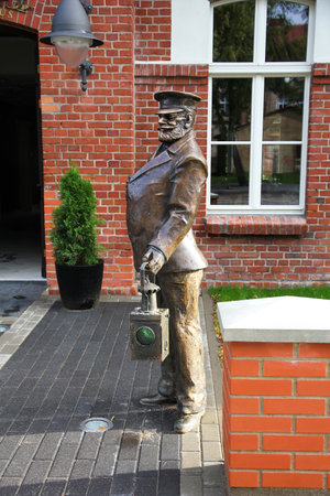 Klaipeda, Lithuania - August 12, 2011: Bronze Sculpture of Railwayman Switchman in Uniform with Lantern on Klaipeda Street.のeditorial素材