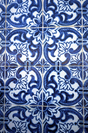 Azulejo - Traditional Glazed Tile on Walls of Portuguese Buildings - in Aveiro, Portugal.  Floral Blue and White Pattern.の写真素材