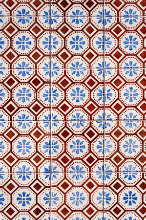 Azulejo Tile on Wall of a Building in Aveiro, Portugal. Floral Red, Blue and White Pattern.の写真素材