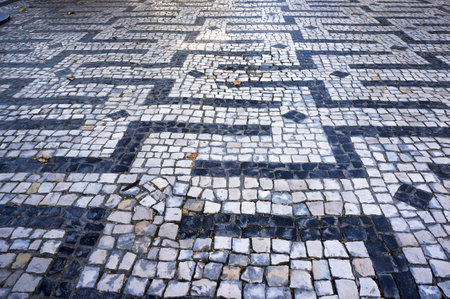 One of Geometric Patterns in Traditional Mosaic Paving Tiles in Braga, Portugal.
