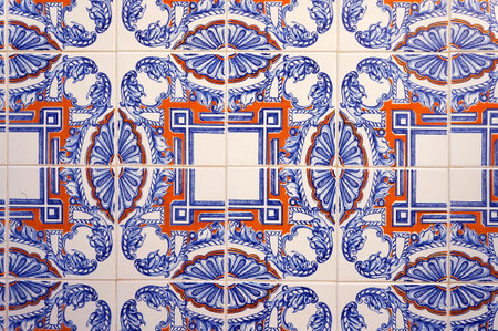 Azulejo Tile on Wall of a Building in Alfama District, Lisbon, Portugal. Blue, Orange and White Pattern.の写真素材