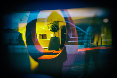 Reflections of Street in Window Glass in the Evening. Abstract Colorful Urban Background.の写真素材