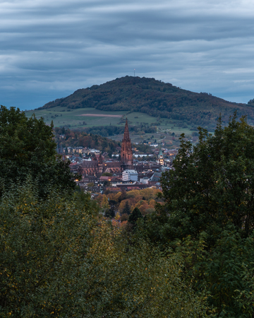 City next to autumn forest, Freiburg (Germany)の写真素材