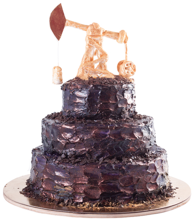 Black handmade cake with oil derrick on a substrateの写真素材