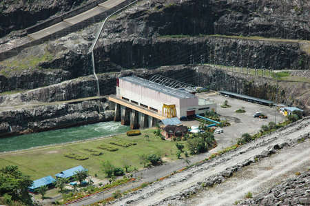a hydro power station behind a damの写真素材