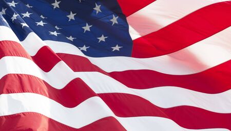 Photo of American flag waving in the windの写真素材