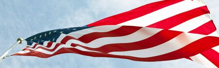 Photo of American flag waving in the wind