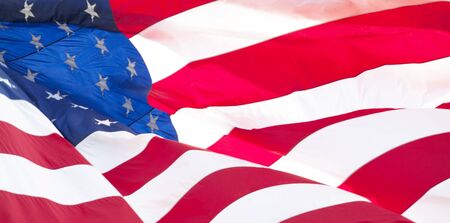 Photo of American flag waving in the windの写真素材