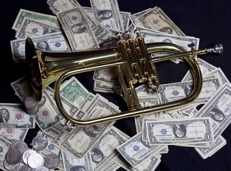 Close up view of flugelhorn and old US moneyの写真素材