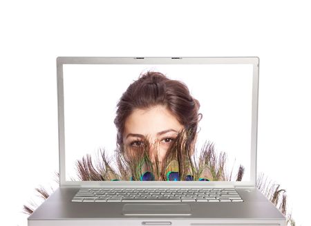 Beautiful female with fan looking through laptop on white isolatedの写真素材
