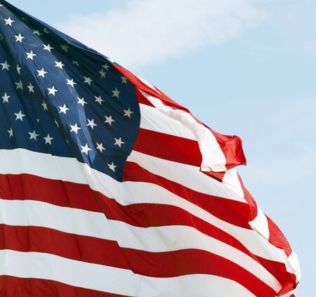 Photo of American flag waving in the wind