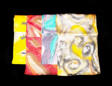 Multi coloured silk scarfs on black isolated