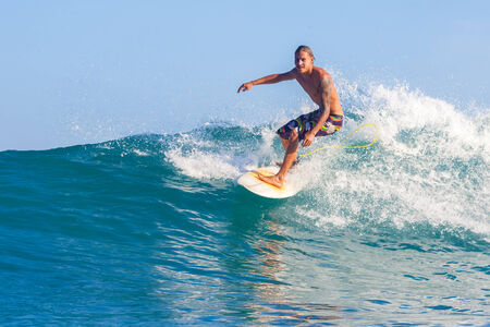 picture of surfing a wave in Indonesia.