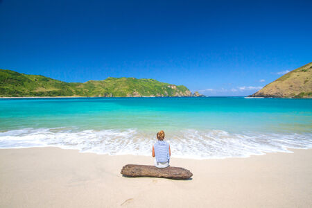 picture of long haired young woman on tropical beach Lombok island Indonesia の写真素材