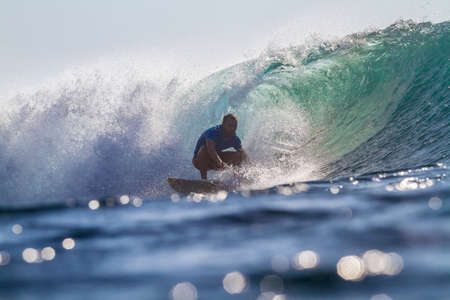 Picture of Surfing a Wave at Sunrise Timeの写真素材