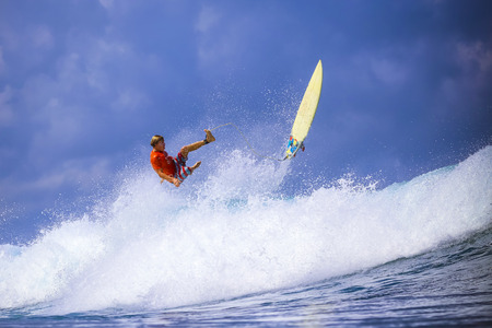Surfer on Amazing Blue Wave, Bali island.の写真素材