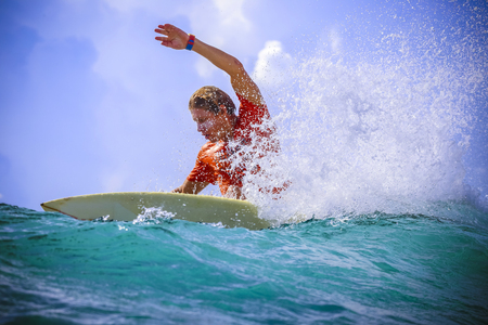 Surfer on Amazing Blue Wave, Bali island.の写真素材