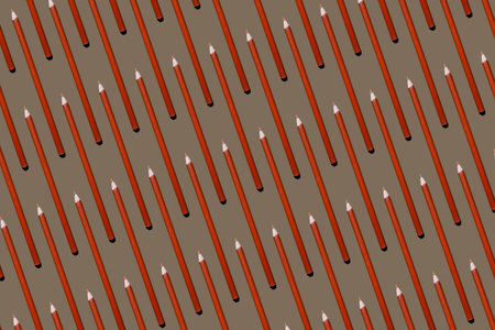 Pattern of orange pencils at brown backgroundの写真素材