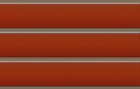 Pattern of orange pencils at brown background