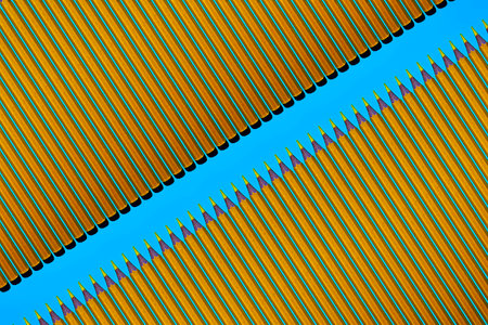 Pattern of yellow pencils at blue backgroundの写真素材