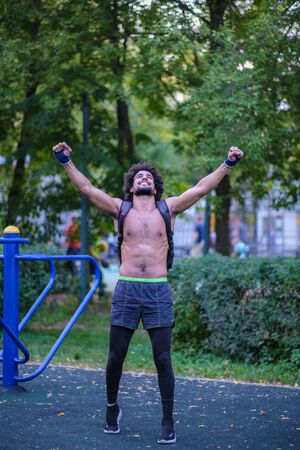 Boxer trains on a street sports groundの写真素材