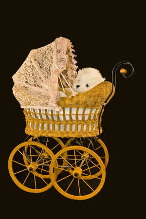 Old Fashioned Child's Baby Buggy with Teddy Bearの写真素材