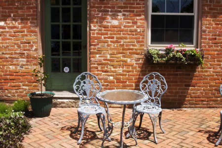 Outside cafe' with table and chairs made out of cast ironの写真素材