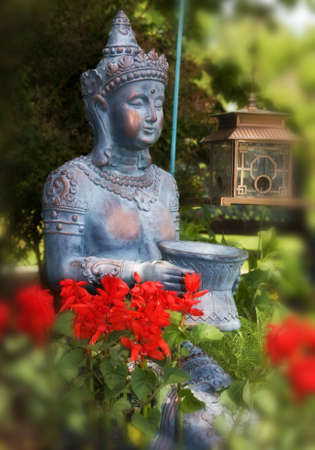 Princess buddha statue in gardenの写真素材