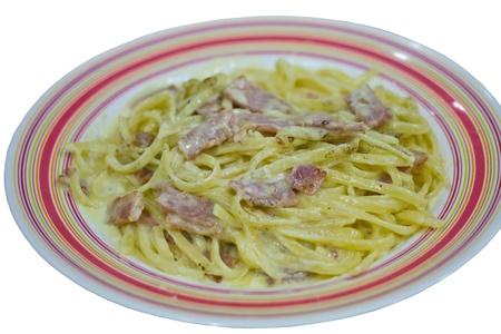 spaghetti cabonara with bacon on the nice plastic plateの写真素材