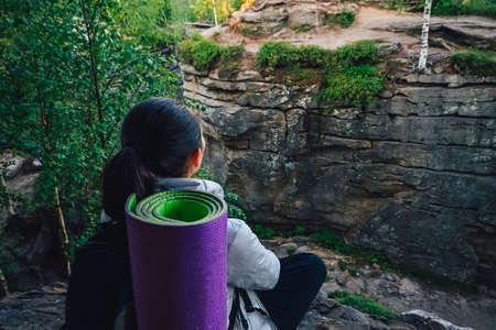 young woman backpacker enjoy the view at mountain peak.の写真素材