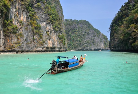 KRABI, THAILAND - DECEMBER 27, 2012 Traditional Thai wooden longtail boat on the shore of Bamboo Island, day trip.のeditorial素材