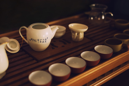 Traditional Chinese tea ceremony, dishes on wooden teaboardの写真素材