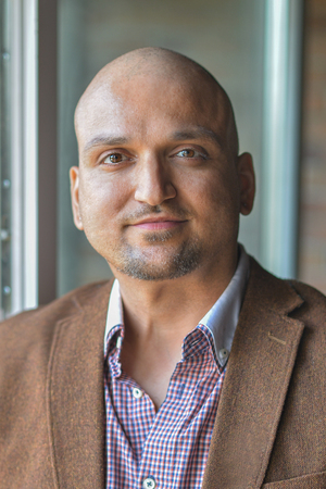 Closeup headshot portrait, happy handsome indian business man, smiling, confident and friendly...