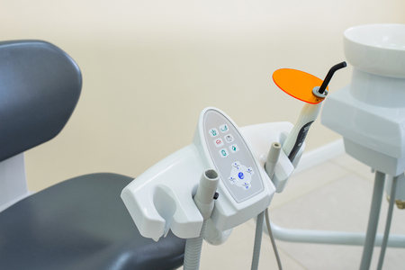 Dental UV curing light lamp . Ultraviolet polymerization Light Tool With Orange blocking glass. tooth care concept.の写真素材
