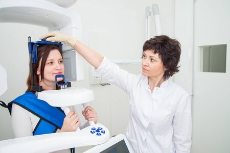Dentist taking a panoramic digital X-ray of a patient s teethの写真素材
