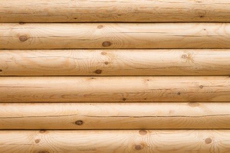 Wooden wall made of logs, backgroud textureの写真素材
