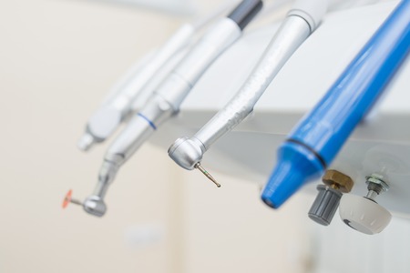Closeup shoot of dental instruments in clinic, turbines, handpieces and drills.の写真素材