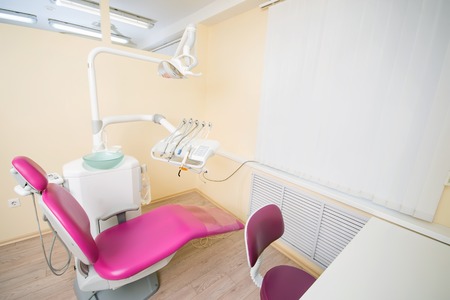Modern dental office. Dental chair and other accessories used by dentists.の写真素材