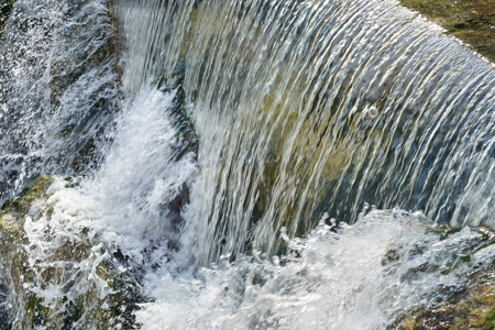 Water surface flow, close up of waterfallの写真素材