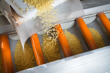 industrial production of pasta on automated food factory.の写真素材