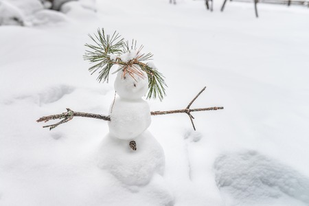 Small funny snowman on winter backgroundの写真素材