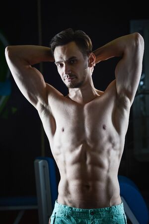 Strong Muscular man with naked torso abs showing muscles and looking at camera.の写真素材