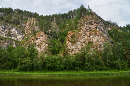Beautifeul mountain river landscape in bright summer day, scenic rock formation on river bank.の写真素材