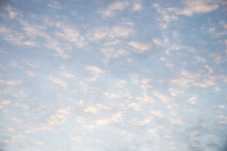 Cloudy sky at sunrise for background. A lot of torn clouds .の写真素材