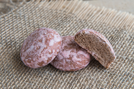 Russian pink chocolate gingerbreads on a sackcloth napkin, rustic bacgroundの写真素材