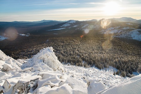 Winter mountains landscape on a bright sunny day with sunlight and glare.の写真素材